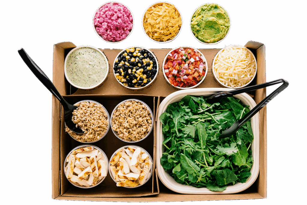 Boxed salad kit with leafy greens, grilled chicken, brown rice, cheese, guacamole, salsa, black beans with corn, dressing, pickled onions, and tortilla strips in separate cups.