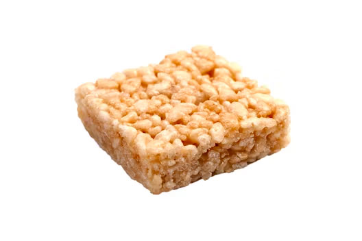 Close-up of a classic crispy rice treat square made with puffed rice cereal and melted marshmallow.