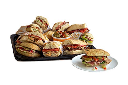 Multiple sandwiches displayed on a serving tray.